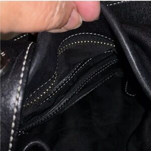 Use black leather Coach Purse with Silver accents.